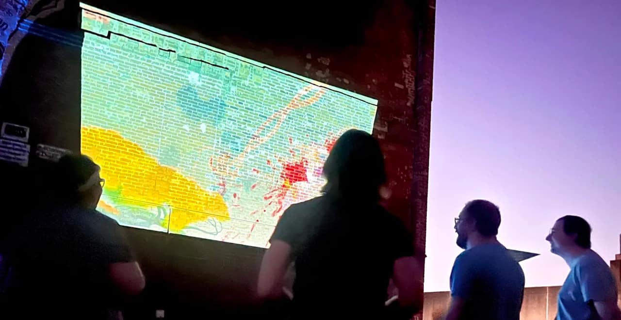 Folks playing locally-made games at Local Game Harvest hosted by louisville Makes Games 2024