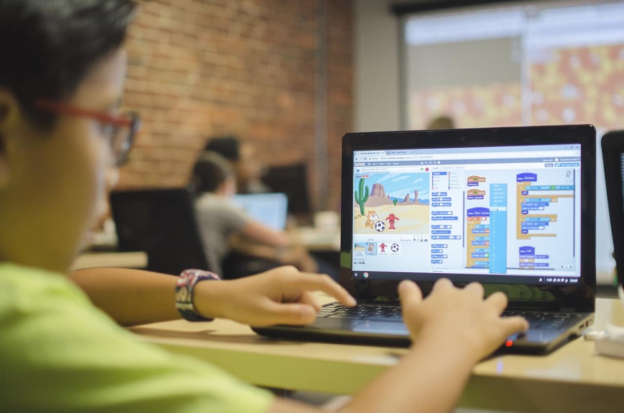 Louisville Makes games Summer Game Design Camp student using scratch on a chromebook